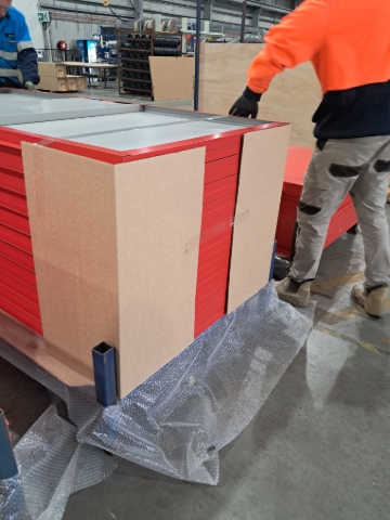 <p>Place cardboard corners on each corner, make sure the cardboard corner is slightly short then the product.</p><p>This is to help secure the product.</p>
