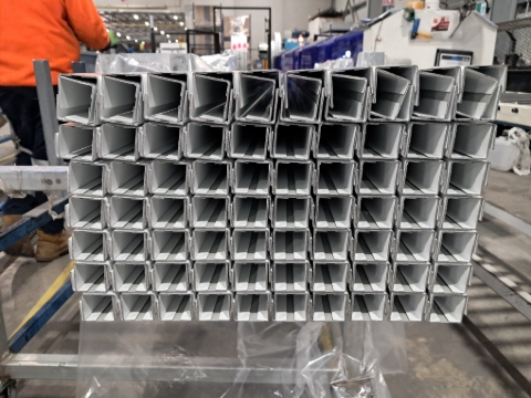 <p>Start stacking the product.</p><p>Two pieces of channel fit inside of each other.</p><p>On the old trolley they fit 20 pieces across.</p><p>On the new trolley they fit 26 pieces across.</p><p>Make sure the channel is equal at both ends. </p>