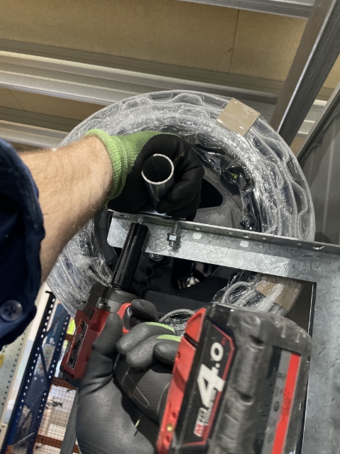 <p>Once door is in the correct place, using a rattle gun, tighten the nuts.</p><p>Make sure to keep the shaft pushed to the front of unit.</p>