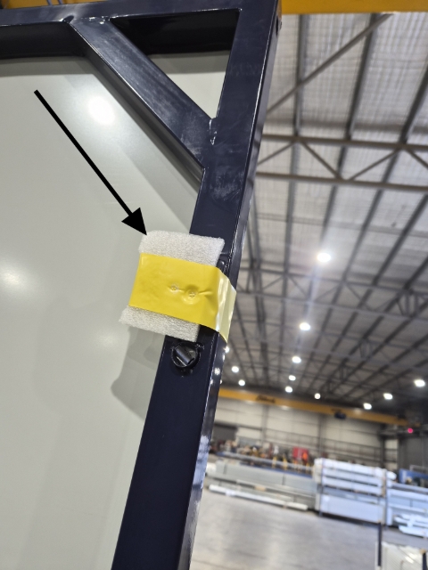 <p>Remove all the protective packaging from around the edge of the frame.</p>