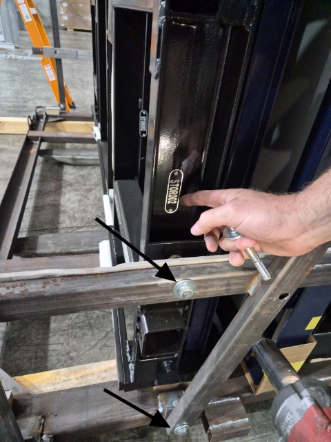 <p>Remove the bolts holding the container to frame with the rattle gun.</p>