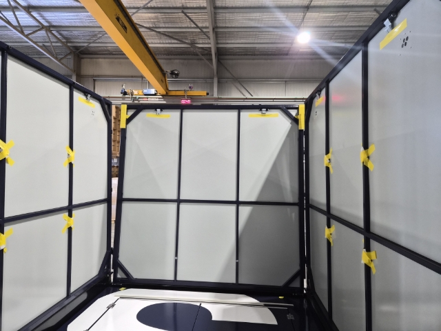 <p>Lift up the back wall.</p><p>This might be a two or three-person job.</p><p>One person will lift the wall, the other person/s may need to move the side walls to make it easier for the back wall to be lifted.</p><p>Be careful as you will need to walk on the front wall, so remove shoes or ensure there is nothing in the shoes that will scratch or dent the front wall.</p>