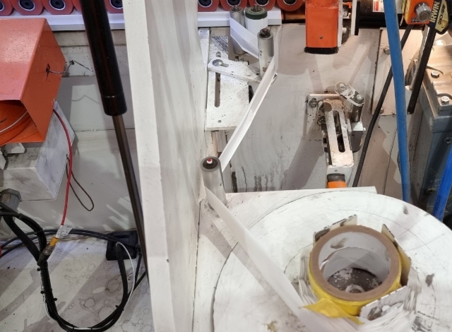 <p>Wind tape (colour side outwards) through the tape system and onto rotating wheel to “Tie Off”</p>
