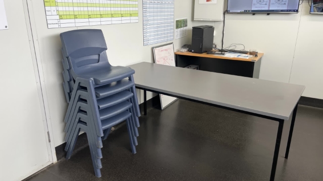 <p>Stack chairs to one side.</p>