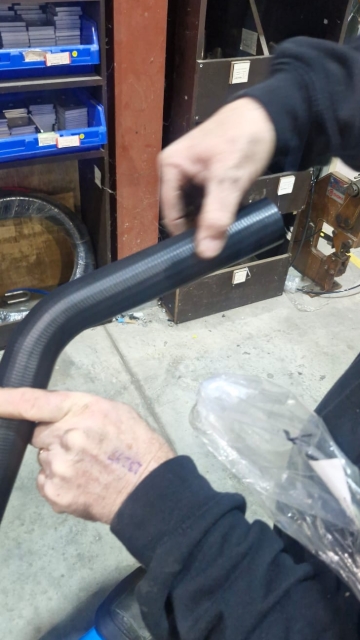 <p>Cut the 45-degree hose where the finger is showing.</p>