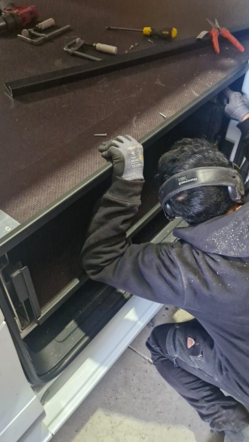 <p>Fit the J-bar to each van door side.</p>