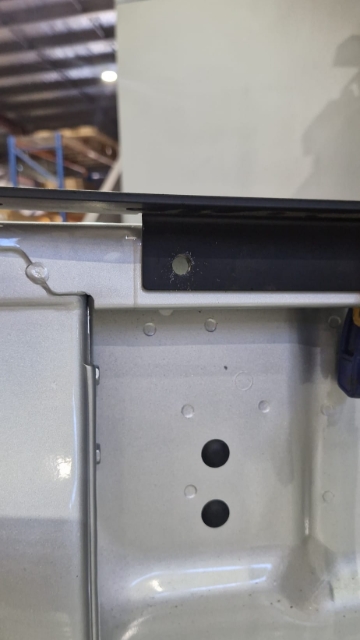 <p>Drill a hole through the wellside, ensuring not to go through to the outside.</p><p></p><p>Ensure that both sides are sitting at the same height. 2 holes will need to be drilled on each side.</p>
