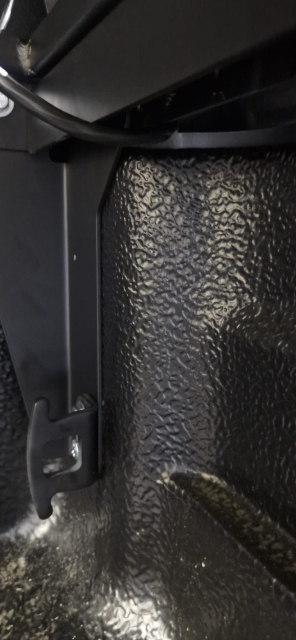 <p>Route the cab to the canopy loom through the hole and down the front of the wellside. This will be on the driver's side.</p>