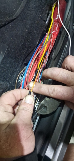 <p>Connect the brown wire from the in-cab loom to the orange factory wire. Ensure to solder and use electrical tape.</p>
