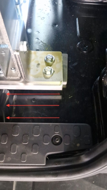 <p>When installing the drawer pull it to the rear of the van just in front of these plastic tabs as shown.</p>