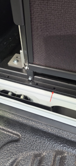 <p>Use the inside hole on each side to drill through.</p>