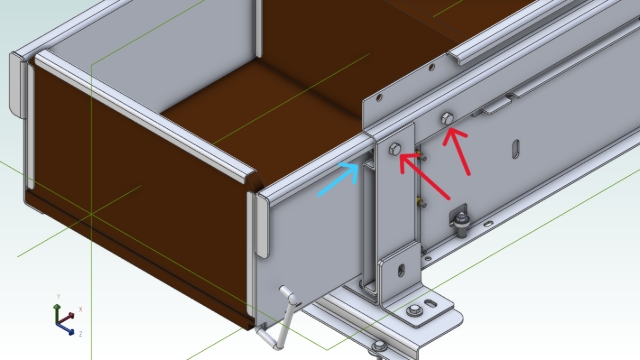 <p>The two red arrows are the bolts that will need loosening. The blue arrow is the bearing that pulls out once loosened. And then the drawer can slide out of the carcass.</p>