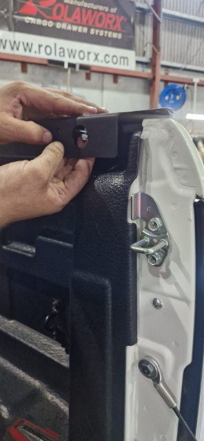 <p>Fit the rear of the side rails to the rear mounts using:</p><p>Screw CSK CAP, M8x25, x2</p><p>WASHER, FLAT, M8, x2<br>NUT, HEX, NYLOC, M8, x2</p>