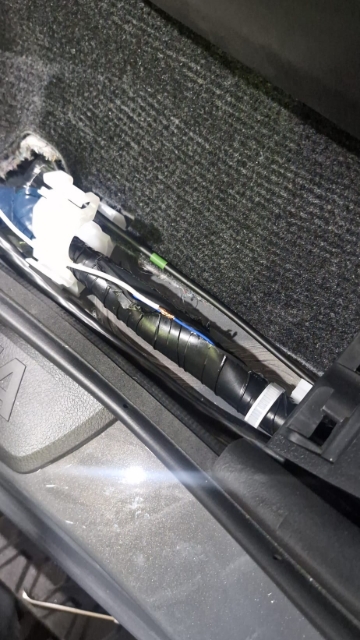 <p>Underneath the door sill on the passenger side, cut open the large loom and locate the thin blue wire; ensure it's not the larger blue wire. and connect to the white wire from the incab loom</p>