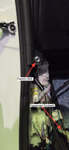 <p>Remove the factory bolt from the passenger side above the wiring block.</p>