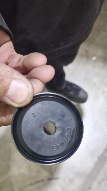 <p>Locate this grommet underneath the passenger side cab and punch a hole through it so the loom can pass through.</p>