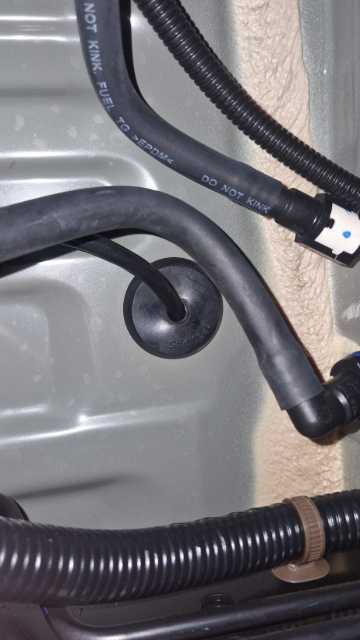 <p>Route the loom into the cab, putting the grommet into the original spot.</p>