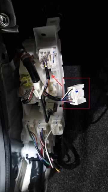 <p>Remove the plug from the spot shown. This is located behind the passenger kick panel.</p>