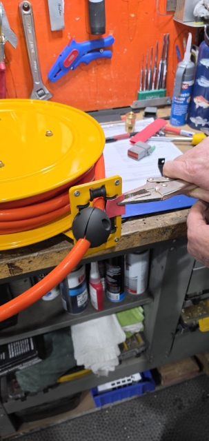 <p>Clamp the bracket for the hose before drilling the rivets.</p>