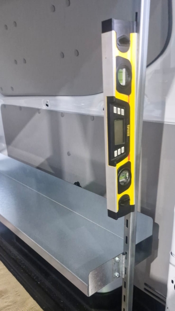 <p>Once the first shelf is installed on both slotted bars. Ensure that both bars are level.</p>