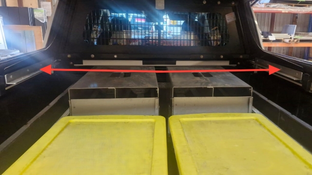 <p>Measure the distance between each side of the cargo barrier. to cut the shelf to length to fit the ranger.</p>