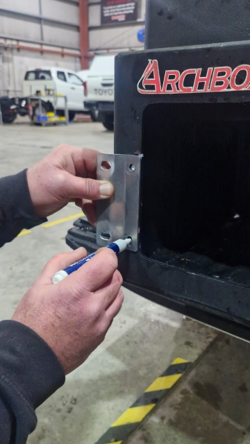 <p>Place the bracket on the mark and closest to the edge as shown. Mark the holes for drilling.</p>