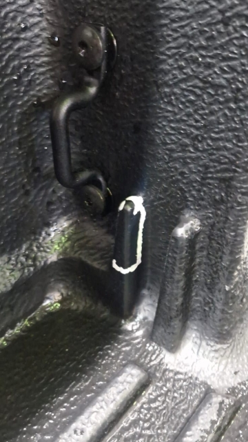 <p>Cut the area that has been marked out, and remove the tie-down point.</p>