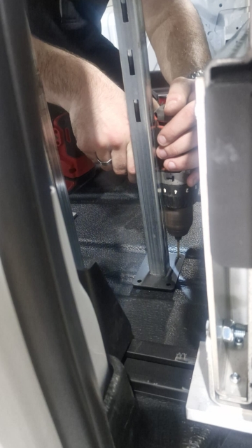 <p>Drill a pilot hole into the base of the leg (CP110240) and into the van floor.</p>