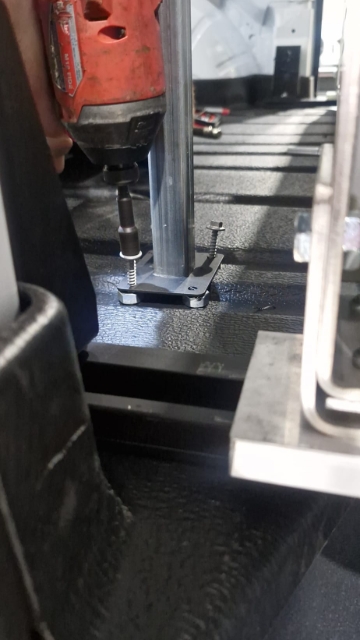 <p>Mount the leg to the floor using hex tec screws, ensuring that it is clear below.</p>