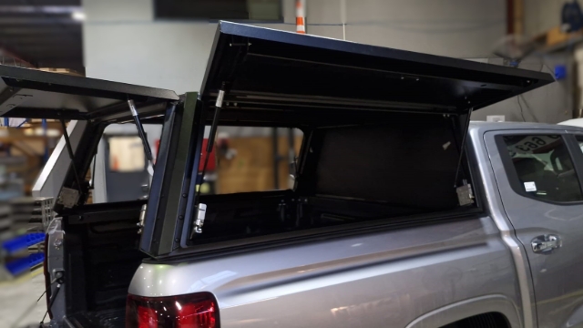 <p>Lift the canopy onto the ute's wellside with at least 4 people.</p>