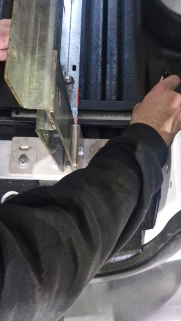 <p>Measure 70mm from the red lines to mark out where to drill.</p>