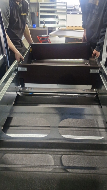 <p>Lift the drawers back into the carcass.</p>