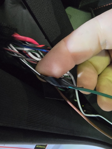 <p>Connect the green wire to the black wire with the white stripe.</p>