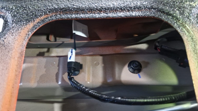 <p>Underneath the panel, reconnect the switch to the tailgate and reinstall the panel.</p>