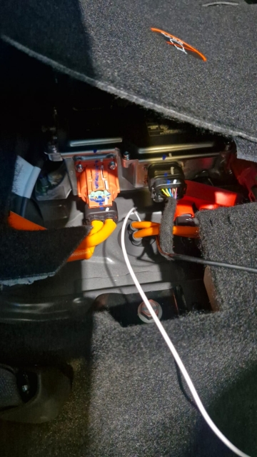 <p>Pull the wire out from under the back seat on the driver’s side.</p>