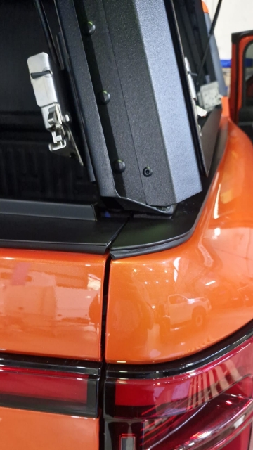 <p>Ensure the tailgate closes without hitting the canopy.</p>