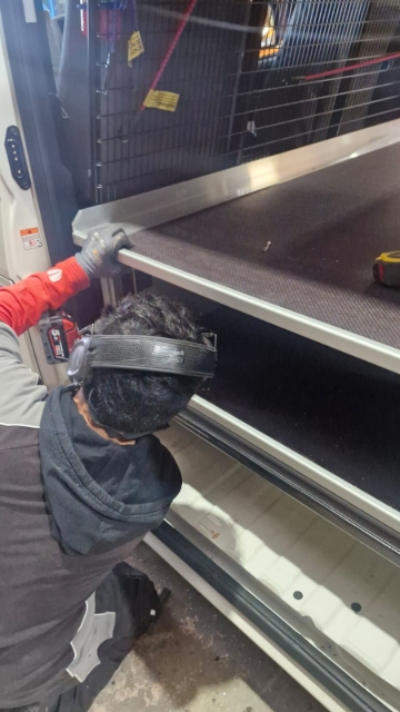 <p>Fit the shorter J-bar to each side of the van.</p>