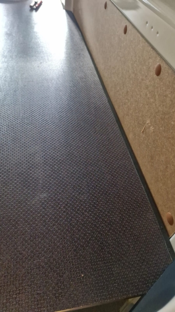 <p>Line the false floor up to the side of the van, ensuring it is a tight fit.</p>