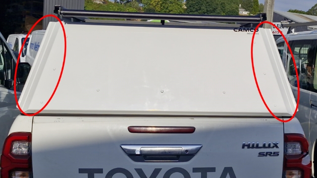 <p>Check that the canopy is correctly aligned. The outer edges of the doors should run parallel with the angle of the rear uprights.</p>