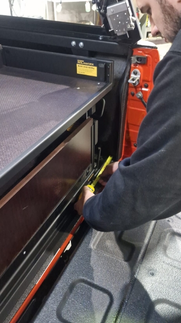 <p>Measure each side and make sure the drawer is centred. It should be 115mm each side. and 15mm back from the white line.</p>