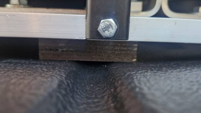 <p>Place two 18mm ply spacers underneath the flat bar as shown before lowering drawer.</p>