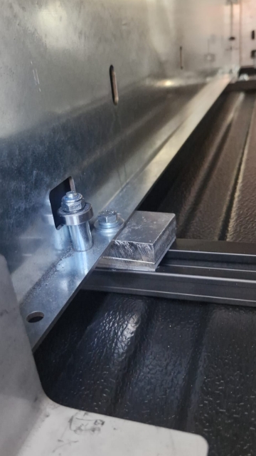 <p>When lifting the drawer into position, stack one 14mm spacer and one 5mm spacer at each of the four bolt locations.</p>