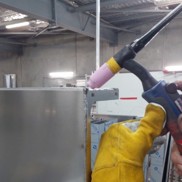 <p>MIG or TIG short sides of front and rear panels, If using MIG any lumps at start of welds can be flattened with TIG torch.</p><p>Clean welds with rag and wire brush.</p>