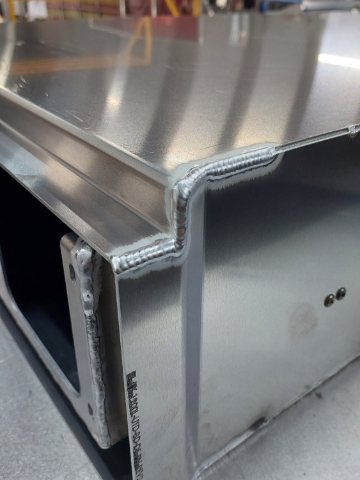 <p>TIG Weld first 150mm of top panel to side panels.<br></p>