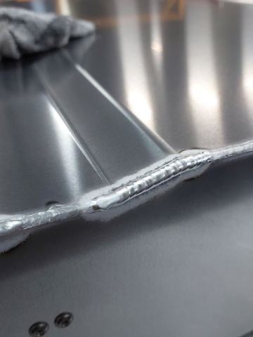 <p>TIG weld steps in base panel between MIG welds.</p>