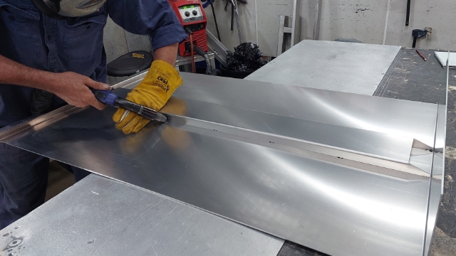 <p>Using MIG torch tack stiffener at each weld indicator notches where you would finish your welds.</p>