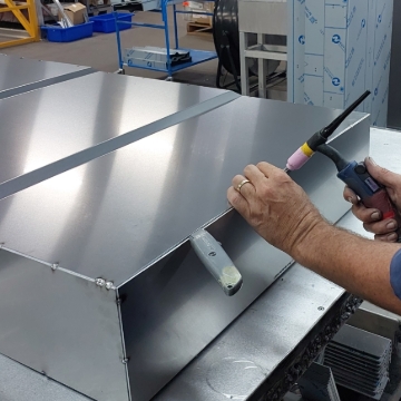 <p>Using TIG torch tack weld base to back panel aligning panels corner to corner as you go.<br></p>