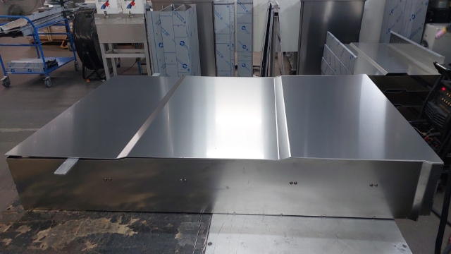 <p>Prep bottom panel for welding and place on drawer body with flat bar at back of drawer as shown to support panel.</p>