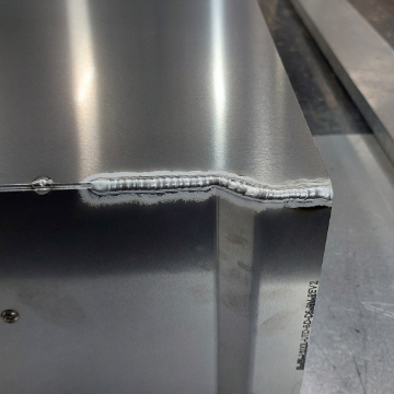 <p>TIG Weld first 150mm of base panel to side panels.</p>