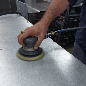 <p>Clean work bench with Orbital Sander and rag.<br></p>